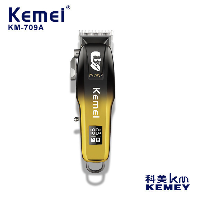 ماشین اصلاح موی سر و صورت کیمی مدل KM-709A با تیغه استیل ضد زنگ، باتری قابل شارژ 2000 میلیآمپر، نمایشگر وضعیت باتری، 4 حالت تنظیم تیغه، قدرت موتور 6500، 4 عدد شانه در سایزهای مختلف، کابل شارژ تایپ C، برس تمیزکننده و روغن روانکننده