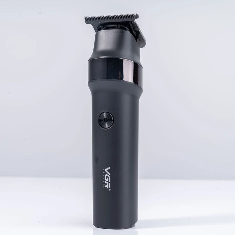 ماشین اصلاح موی سر و صورت وی جی آر مدل V-987 با تیغه سرامیکی و استیل ضد زنگ، موتور دی سی 7000 دور در دقیقه، عملکرد توربو، باتری 2000 میلیآمپرساعتی با 400 دقیقه استفاده و صفحه نمایش الایدی میزان شارژ
