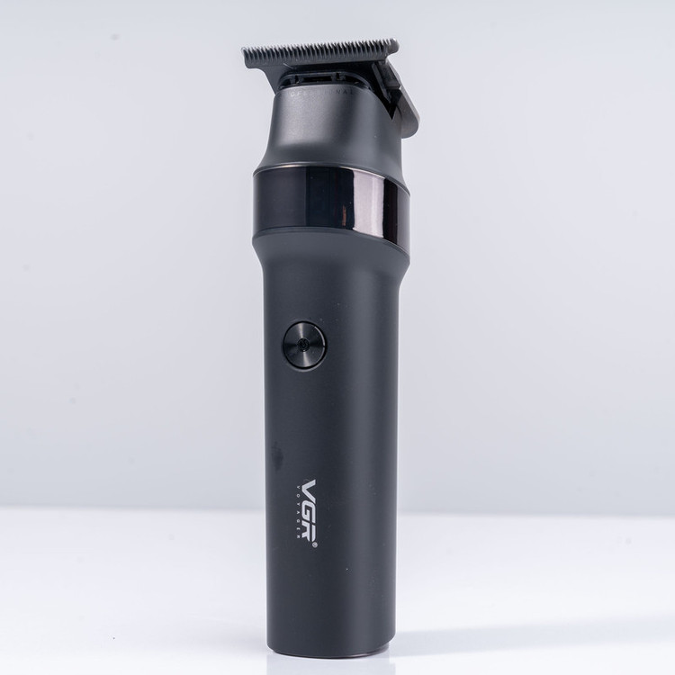 ماشین اصلاح موی سر و صورت وی جی آر مدل V-987 با تیغه سرامیکی و استیل ضد زنگ، موتور دی سی 7000 دور در دقیقه، عملکرد توربو، باتری 2000 میلیآمپرساعتی با 400 دقیقه استفاده و صفحه نمایش الایدی میزان شارژ