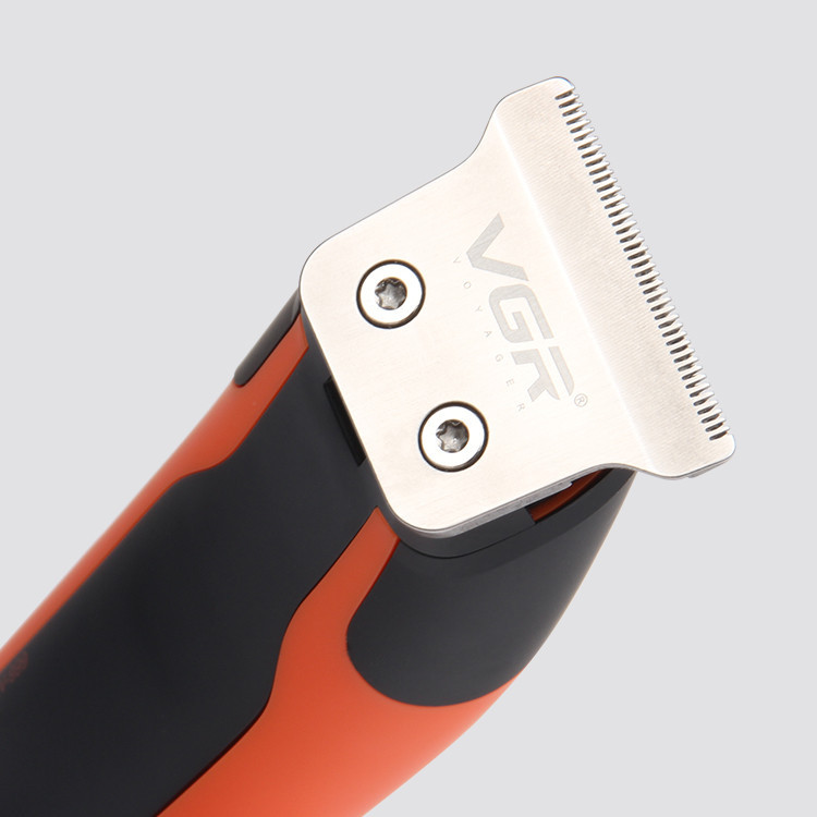 ماشین اصلاح موی سر و صورت وی جی آر مدل V-999 با تیغه استیل پیشرفته، اصلاح دقیق 0.01 میلیمتر، استفاده خشک و مرطوب، باتری شارژی 90 دقیقه کارکرد و 4 شانه تنظیم طول